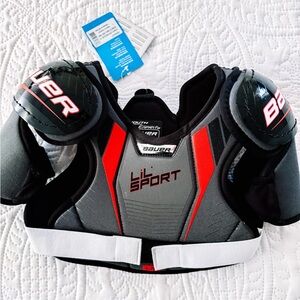 Bauer Youth Shoulder Pads in Black, Red, and Gray
